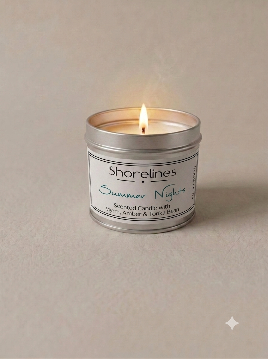 Shorelines Summer Nights scented candle in silver tin, lit